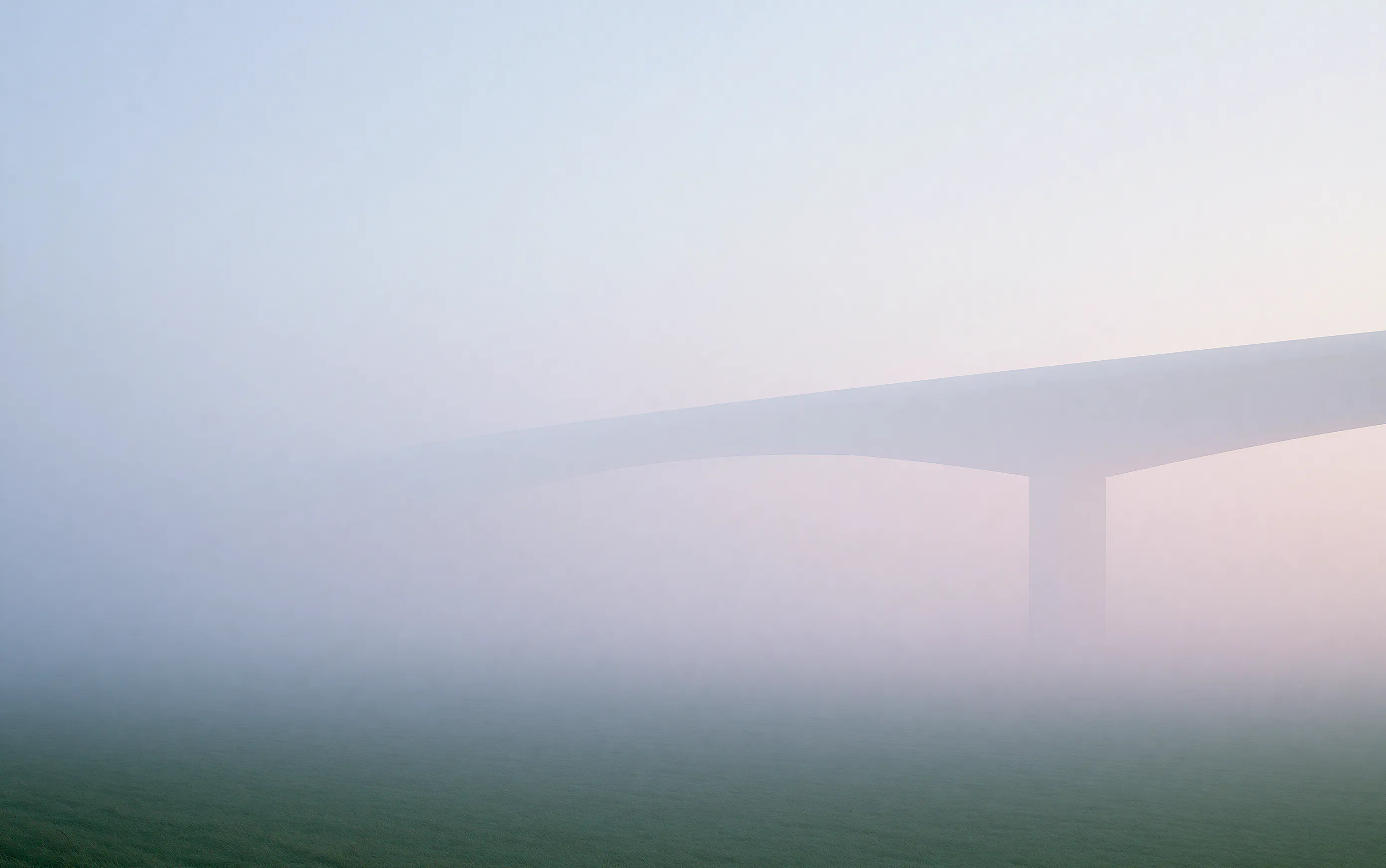 Pale concrete bridge fading into silver fog, a near-white low-contrast frame
