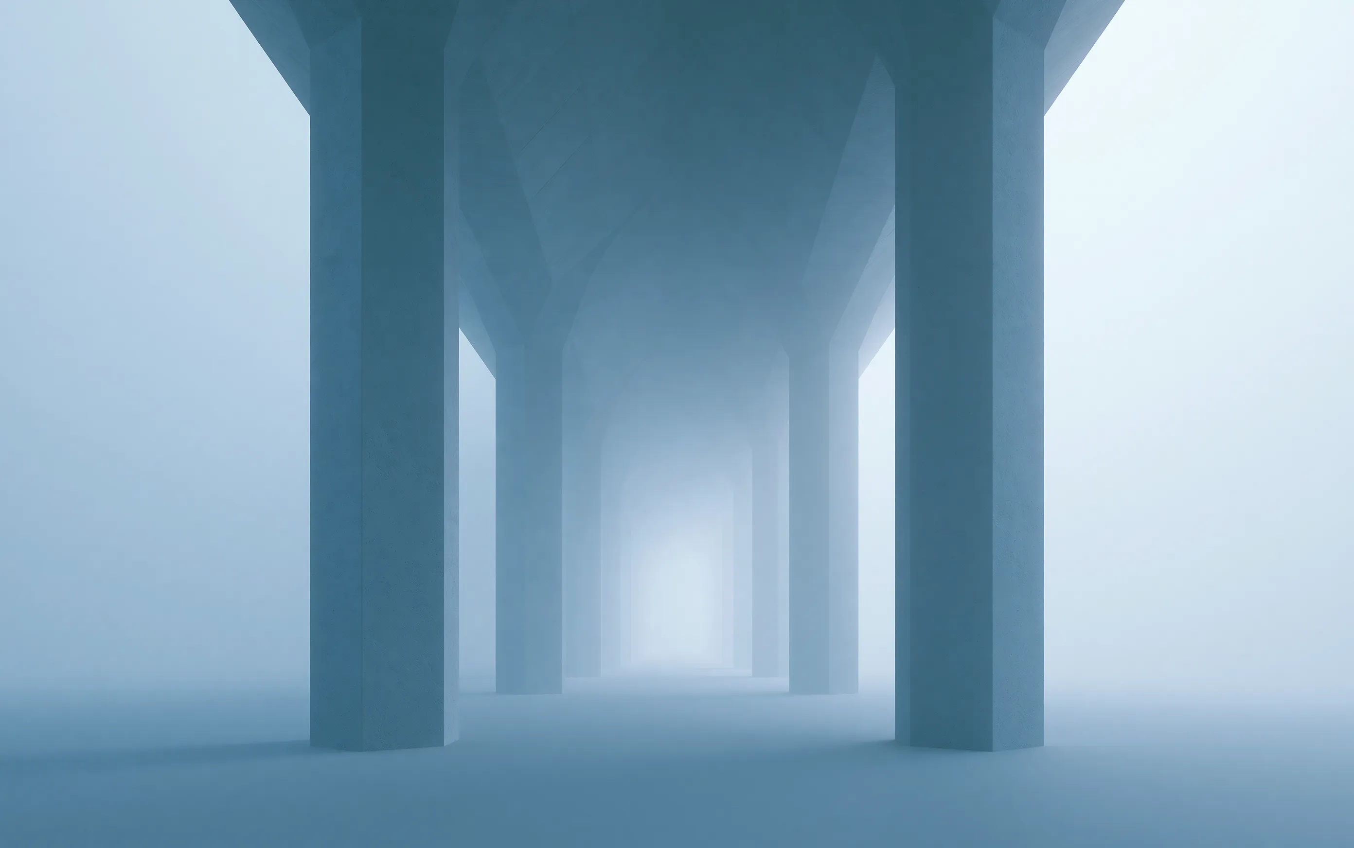 Concrete underpass pillars dissolving into blue-grey fog, an even mid-tone frame