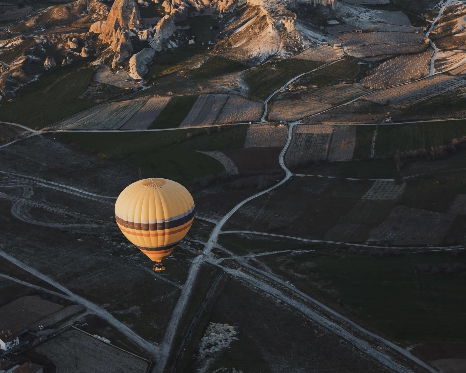 Golden hot-air balloon above Cappadocia