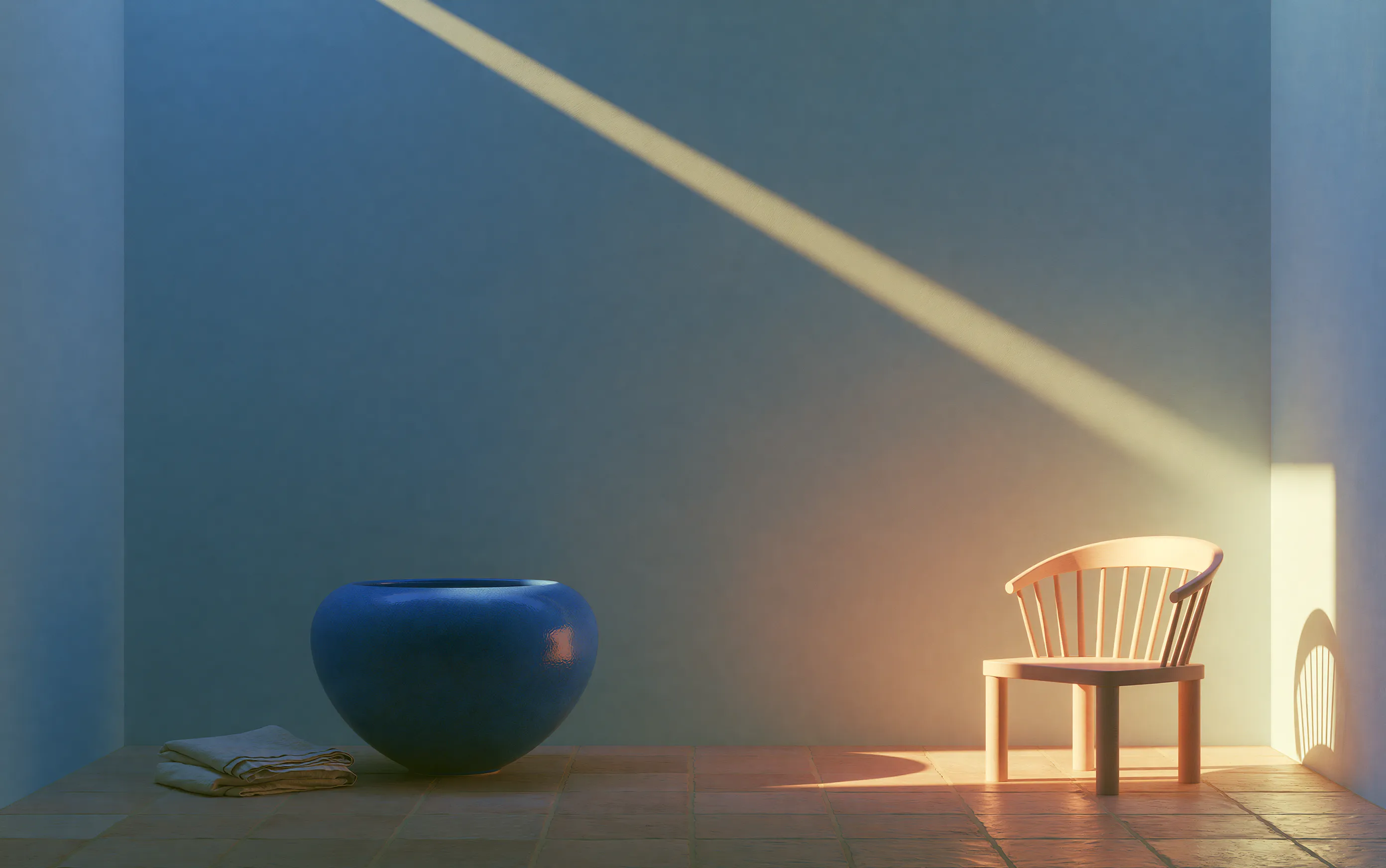 Cobalt bowl, timber chair and floor lamp in a blue-toned studio
